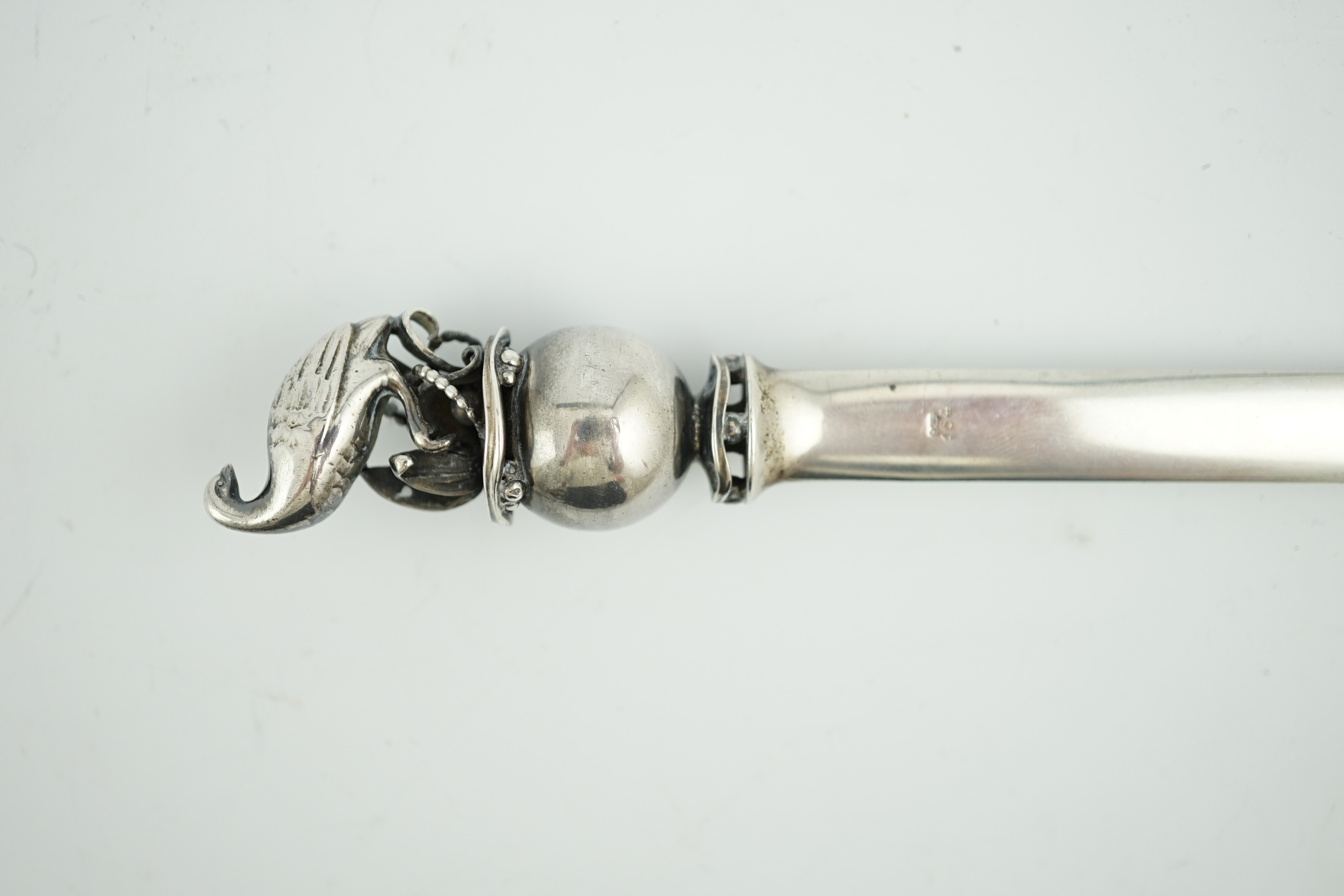 A Georg Jensen sterling silver letter opener, with game bird and sphere finial